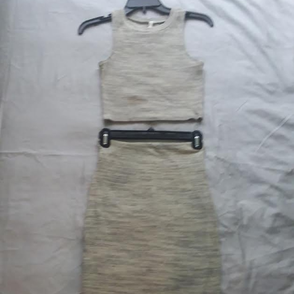 Two piece sleeveless cropped fitted top and skirt